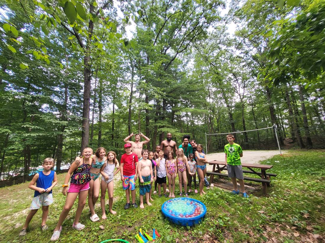 Families at a water balloon game