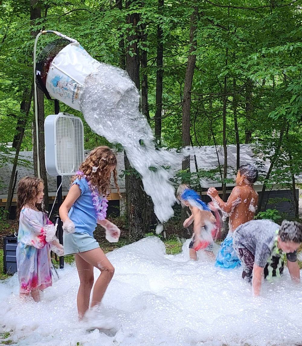 Kids playing at a foam party
